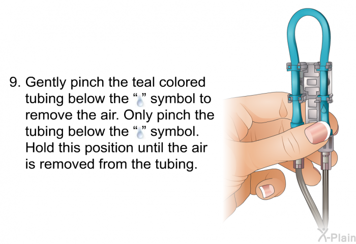 Gently pinch the teal colored tubing below the 